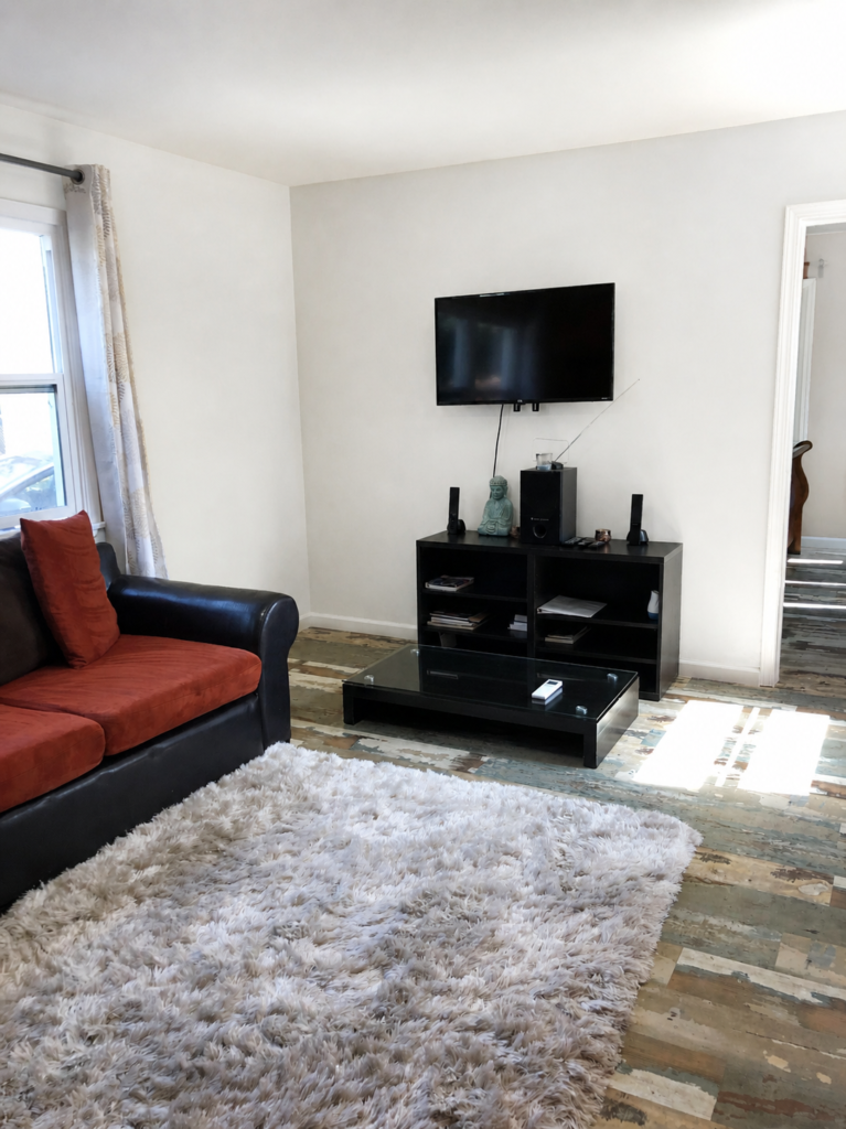 Second furnished Los Angeles living area with sofa and work-friendly layout